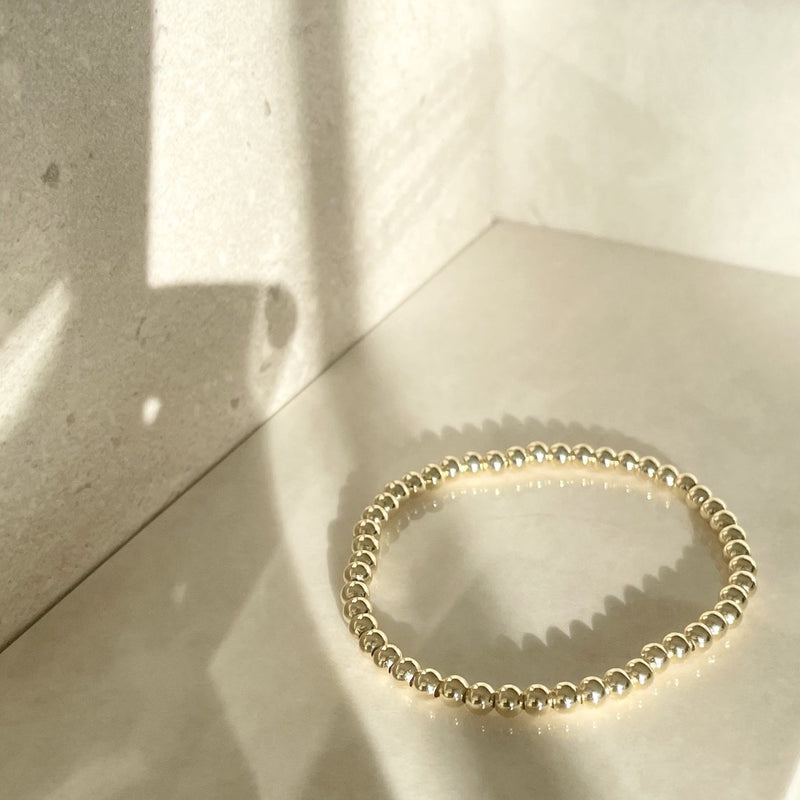 gold plated ball bracelets - gold beaded bracelets - gold beaded ball bracelet that gives back to charity