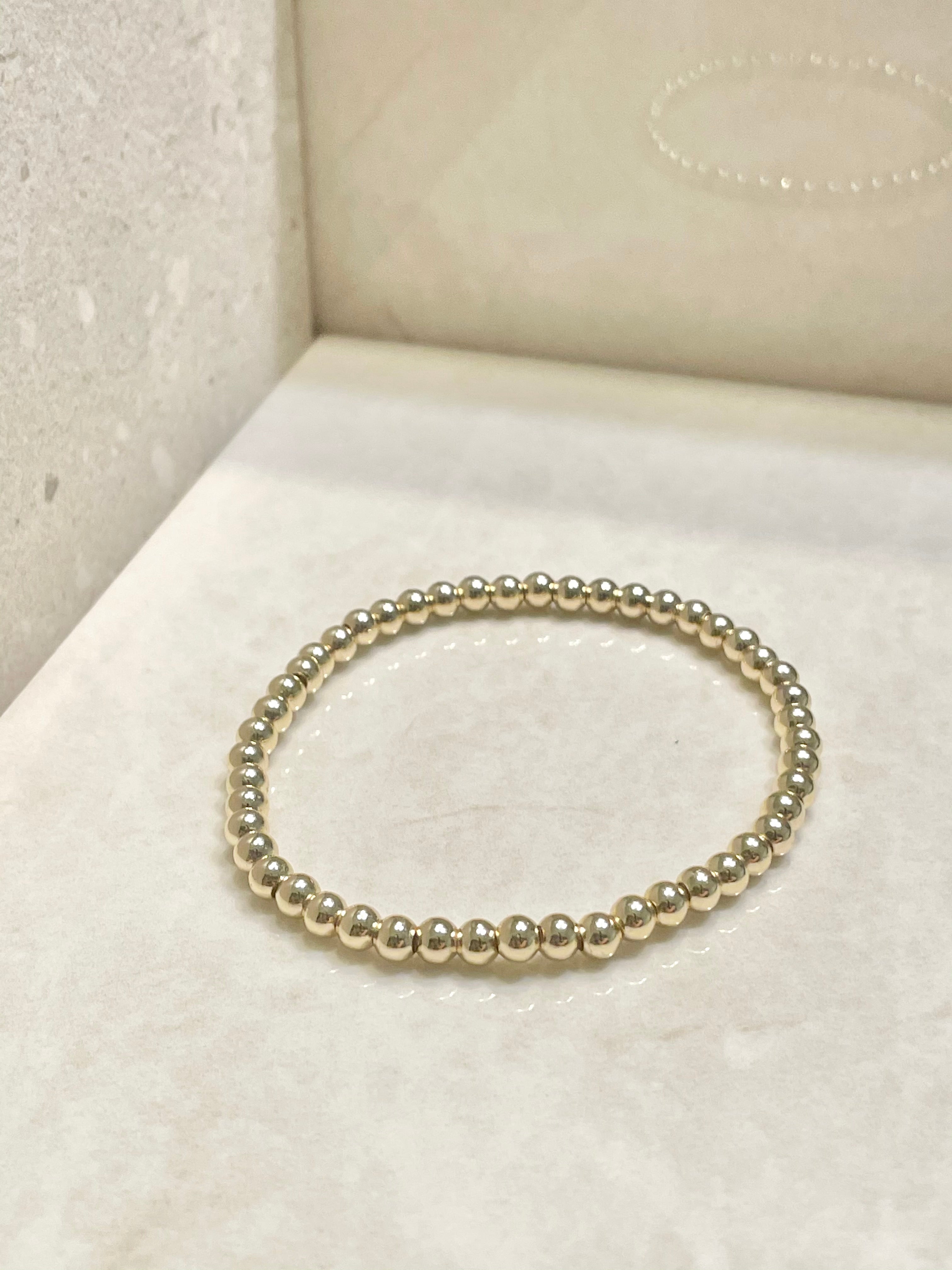 gold plated ball bracelets - gold beaded bracelets - gold beaded ball bracelet that gives back to charity